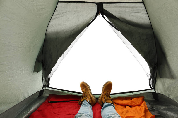 Closeup of man in camping tent on white background, view from inside - Foto, Imagen