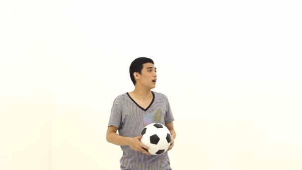 Asian man with ball by head - Video