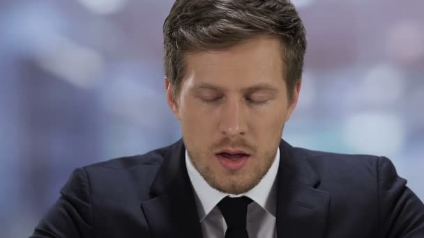 Stressed young man in suit feeling nervous during job interview, employment - Metraje, vídeo