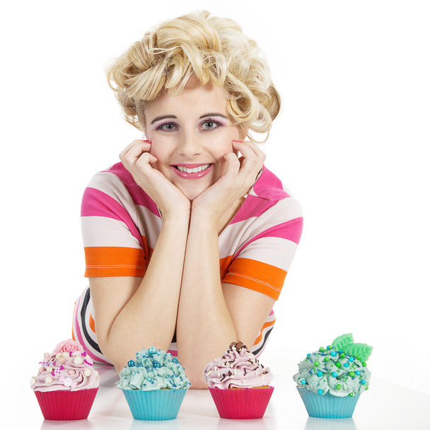 Young smiling woman with cupcake - Photo, image
