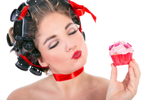 Young smiling woman with cupcake - Zdjęcie, obraz