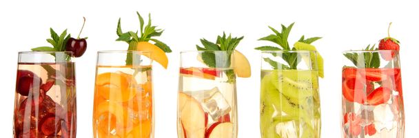 Glasses of fruit drinks with ice cubes isolated on white - Valokuva, kuva