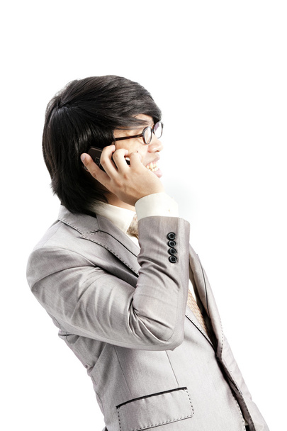 Businessman making a phone call against a white background - Φωτογραφία, εικόνα