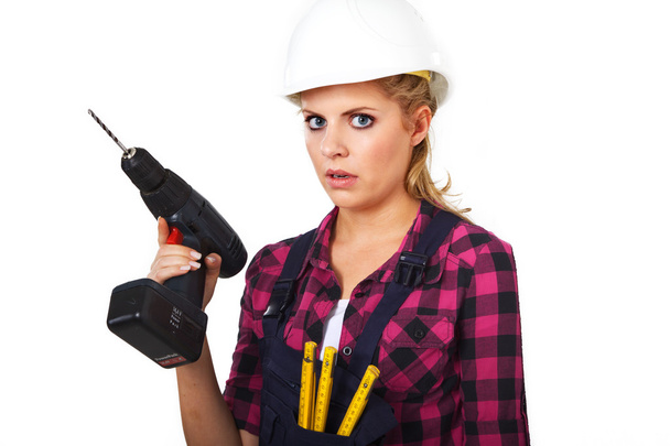 Young woman with drill - Fotoğraf, Görsel