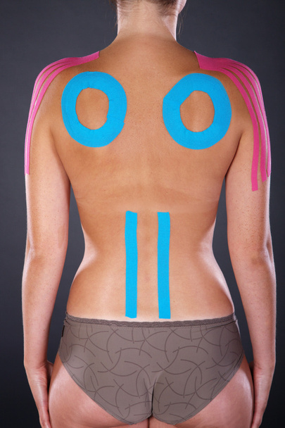 Female body with Kinesio tape - Фото, изображение