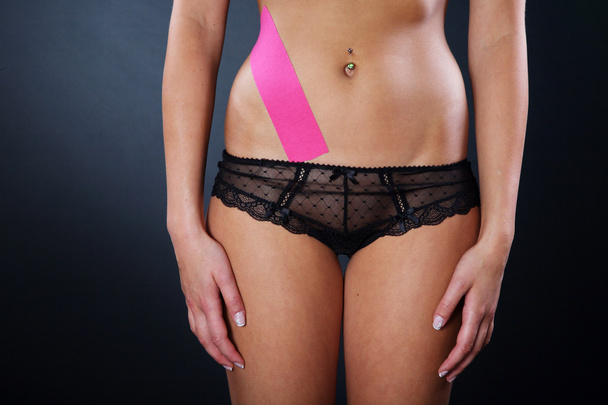 Female body with Kinesio tape - Foto, Imagen