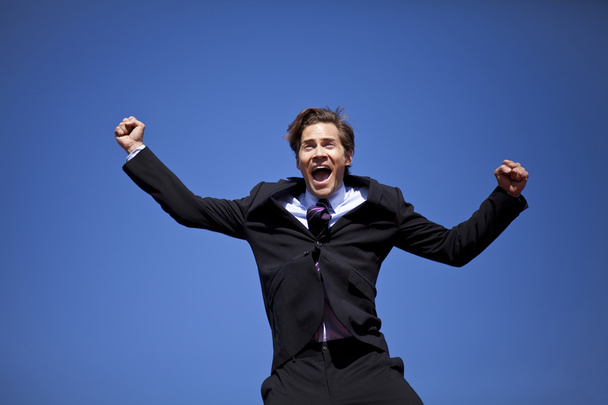 Excited businessman jumping - Photo, Image