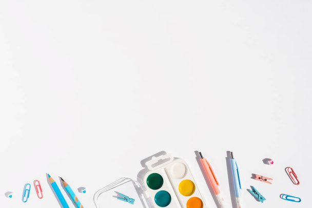 White background with pens and pencils for school advertising. - Foto, imagen
