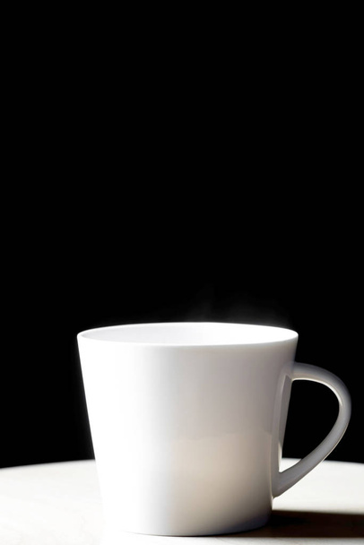 Cup of hot tea on black background - Photo, Image