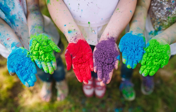 Hands Palms of young people covered in purple, yellow, red, blue Holi festival colors isolated - Foto, Imagen