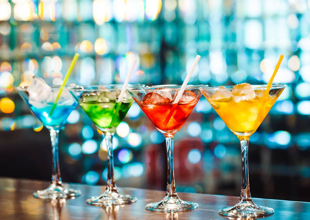 Multicolored tasty cocktails at the wooden bar. - Foto, Imagen