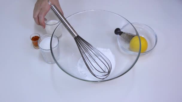 Beating pudding mix, sugar and milk - Footage, Video