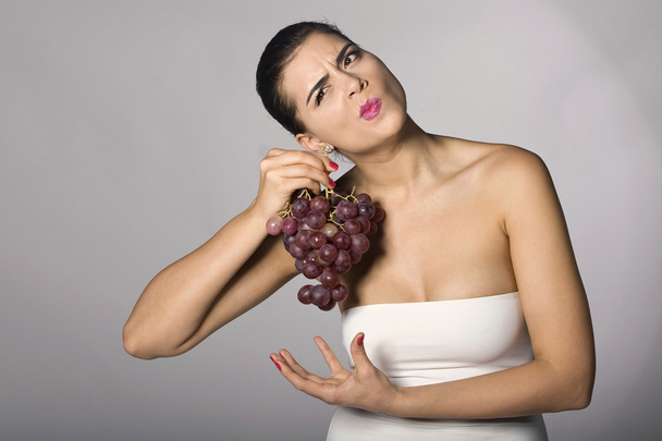 Woman holding red grapes - Photo, Image
