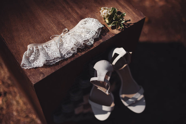 wedding accessories. bridal shoes, garter and boutonniere. vinta - Photo, Image