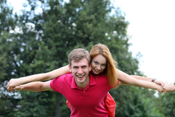Happy young couple in love at the park - Photo, image
