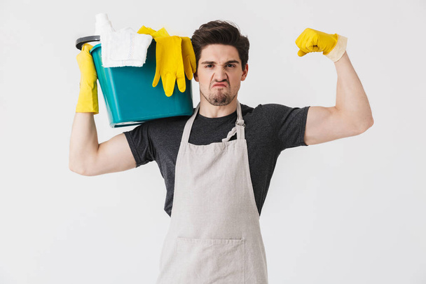 Handsome brunette houseman wearing apron - Foto, Imagem