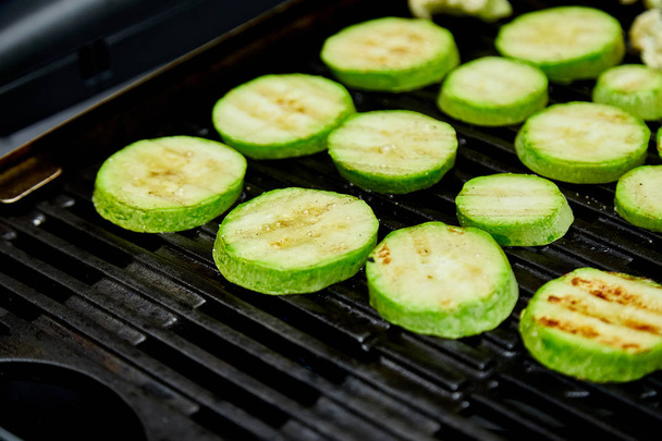 Grilled zucchini vegetable on huge gas grill .  - Photo, Image