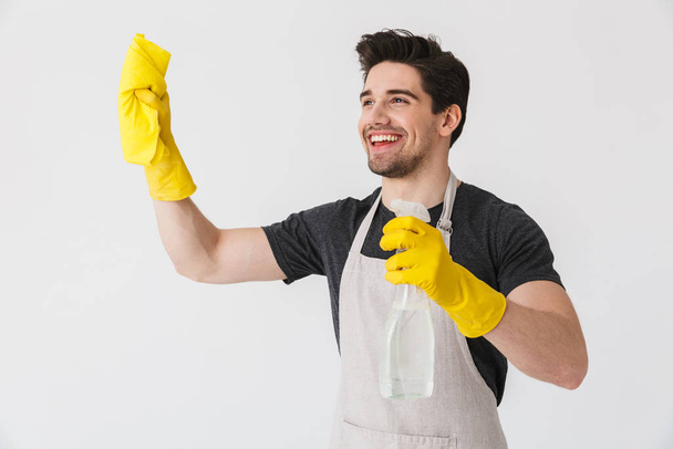 Handsome brunette houseman wearing apron - Foto, Imagem