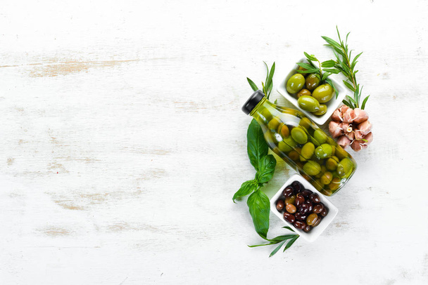 Olives in a jar, olive oil. Top view. Free space for your text. - Fotó, kép