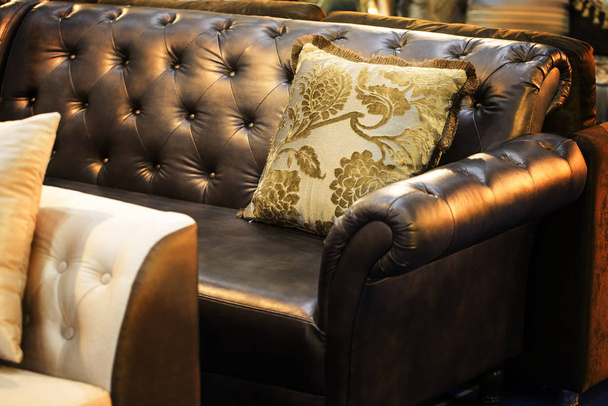 Brown leather sofa is a beautiful backdrop. - Zdjęcie, obraz
