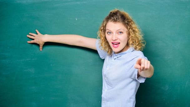 pointing on you. knowledge day. empty blackboard information. university or college life. woman teacher at school lesson. back to school. woman likes studying. student at blackboard. copy space - Foto, Imagen