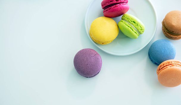 Colorful macarons on white background, close up view - Photo, Image