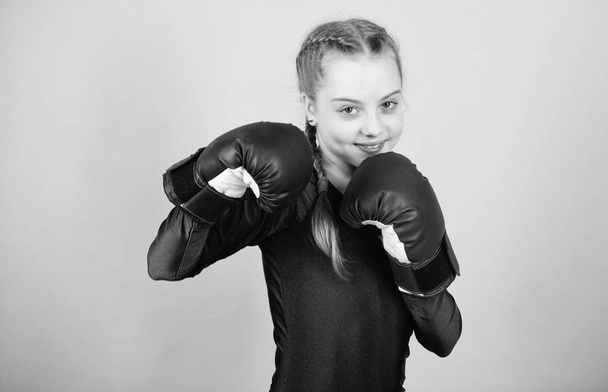 Female boxer change attitudes within sport. Feminism concept. With great power comes great responsibility. Boxer child in boxing gloves. Girl cute boxer on blue background. Rise of women boxers - Foto, immagini