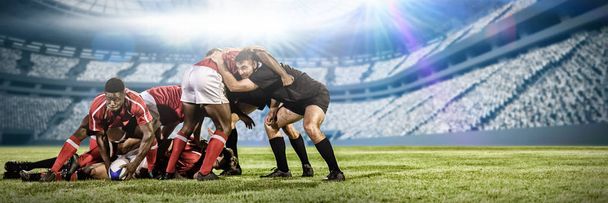 Rugby player scrum against football on field in stadium. - Valokuva, kuva
