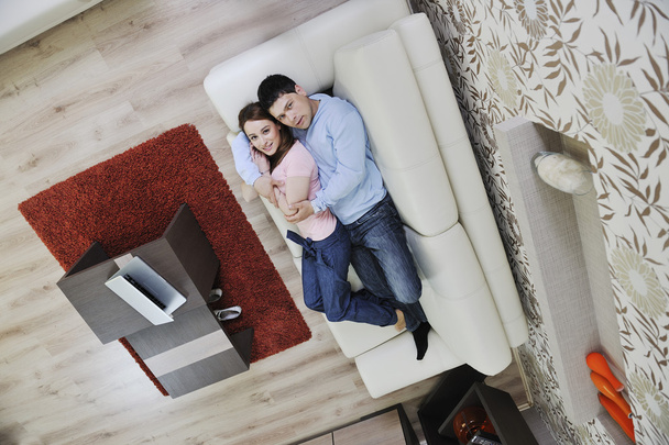 Couple relax at home on sofa - Foto, afbeelding