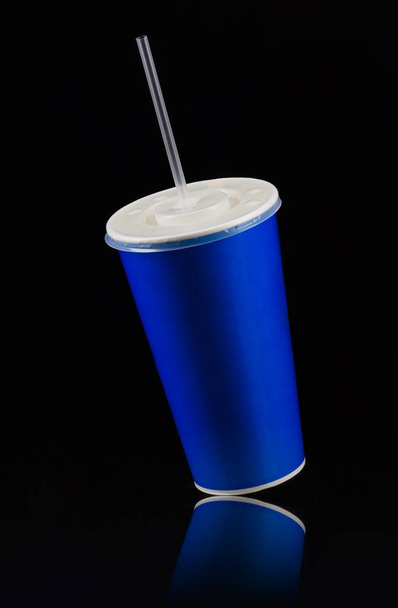 Blue cup with cap and tube isolated on black background - Фото, зображення