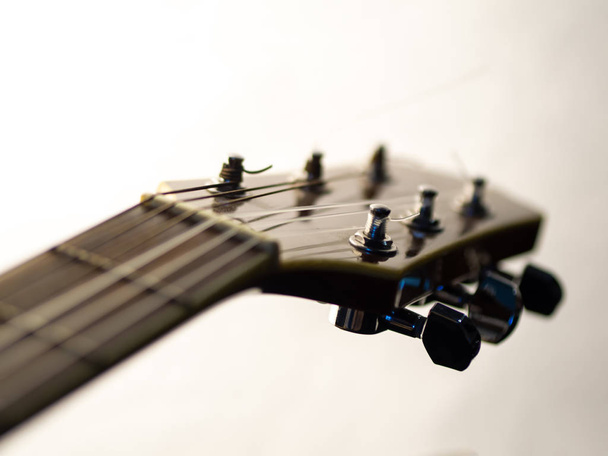 six - string acoustic guitar on a white background. music day - Zdjęcie, obraz