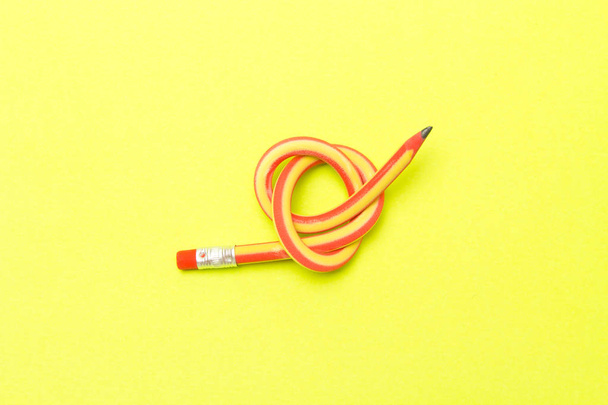 Flexible pencil . The concept of Binding business. Bent pencils  - Photo, Image