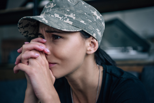 depressed woman in military uniform crying at home - Photo, Image