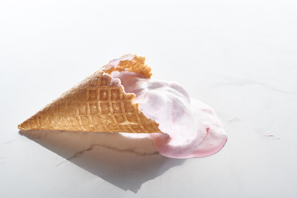 delicious ice cream in waffle cone on marble grey background - Photo, Image