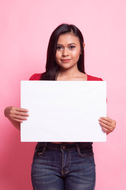Young Asian woman with white blank sign. - Foto, imagen