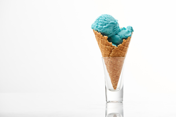 delicious sweet blue ice cream in crispy waffle cone isolated on white - Foto, afbeelding