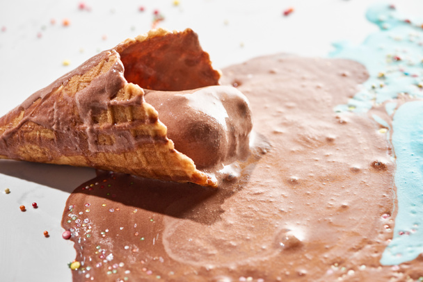 close up view of delicious melted chocolate ice cream in waffle cone - Valokuva, kuva