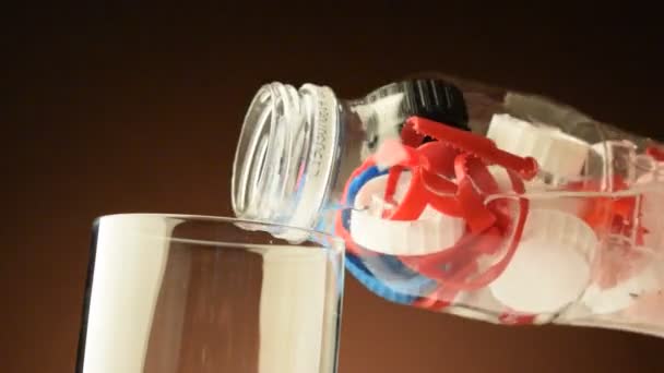 Plastic particles in the water to drink - Footage, Video