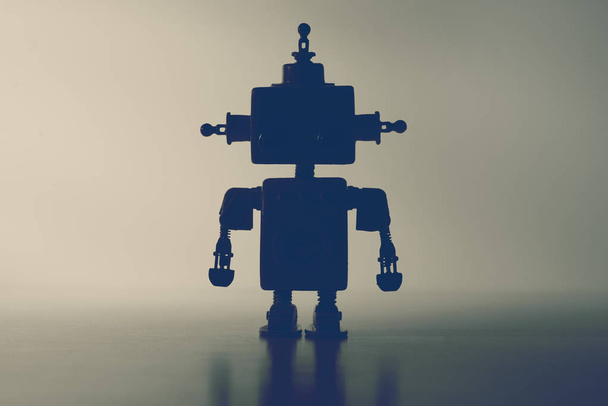 Silhouette of a cute robot on a gray background. - Zdjęcie, obraz
