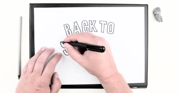 Male hand writing the text: "BACK TO SCHOOL". Time lapse - Footage, Video