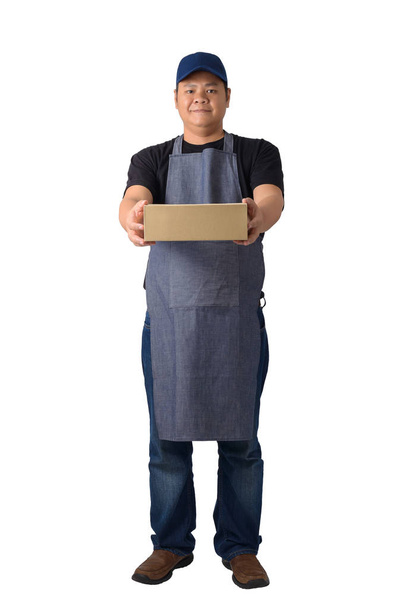 delivery man in Black shirt and apron is holding boxes isolated  - Zdjęcie, obraz