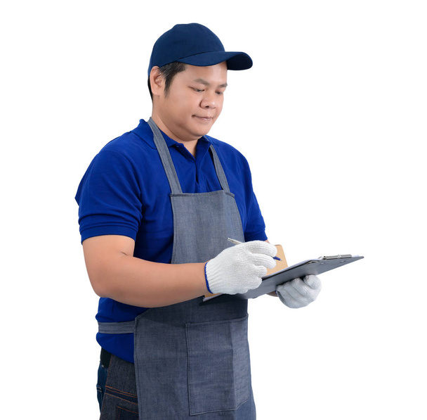 ásia entrega homem trabalhando no azul camisa com avental e protecti
 - Foto, Imagem