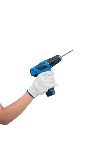 Woman worker hand Wear gloves holding electric drill isolated on - Фото, зображення