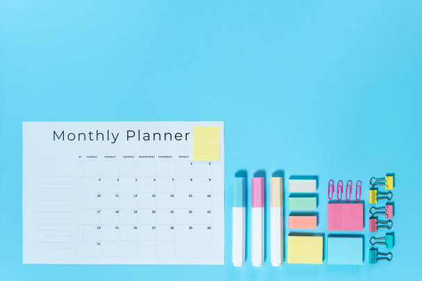 Stationery and planner on blue pastel background - Photo, Image