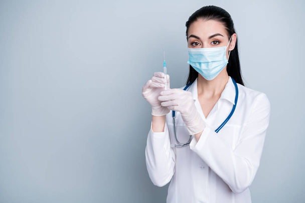Close up photo beautiful she her lady doctor hospital preparing operation insulin epidemic virus flu injection hands arms wear mask rubber gloves phonendoscope white costume isolated grey background - Foto, immagini