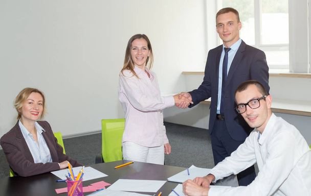 Handshake business partners. New contacts, four people. Group of business people together.  - Fotografie, Obrázek