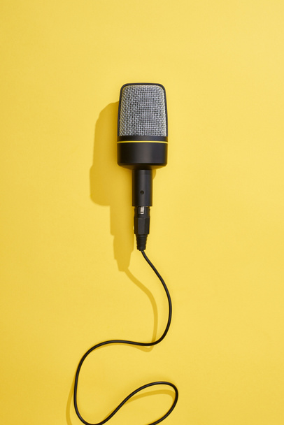 top view of microphone on bright and colorful background  - Photo, Image