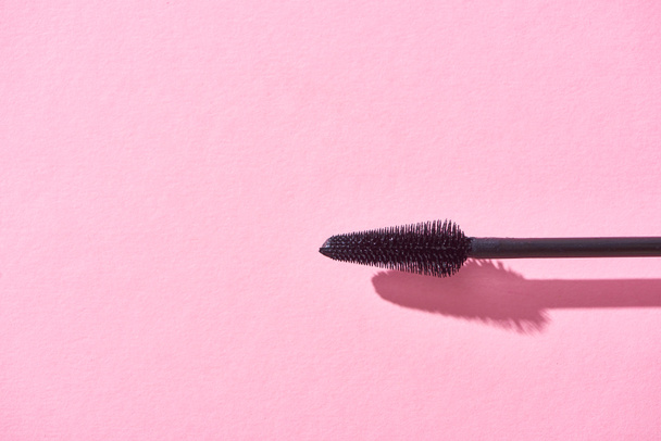 top view of brush for mascara on pink background  - Foto, imagen