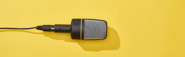 panoramic shot of microphone on bright and colorful background  - Φωτογραφία, εικόνα