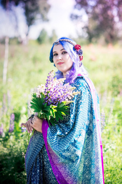 Girl in a sari in lupins - Photo, Image